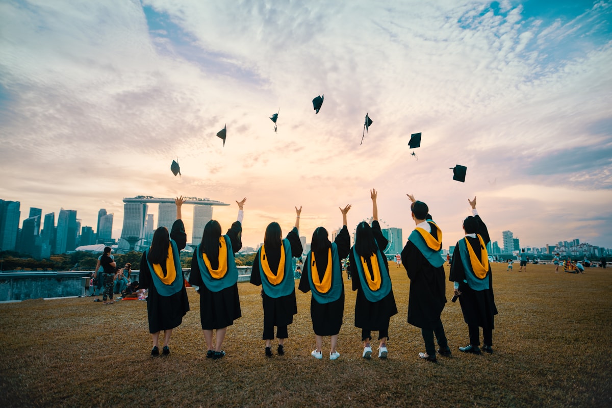 Graduates celebrating together outdoors